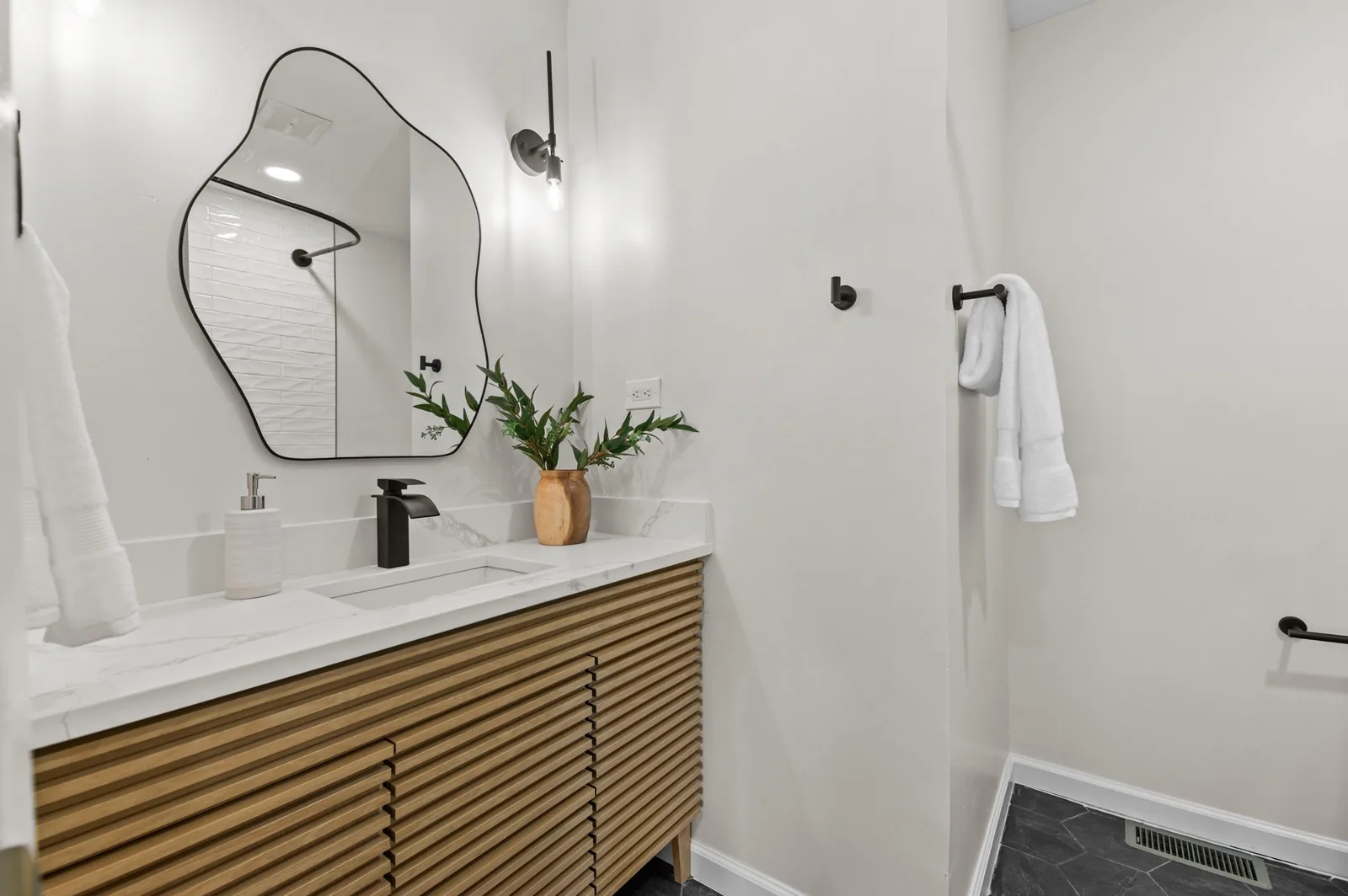 Roxanne: wood-slat vanity and sculpted mirror