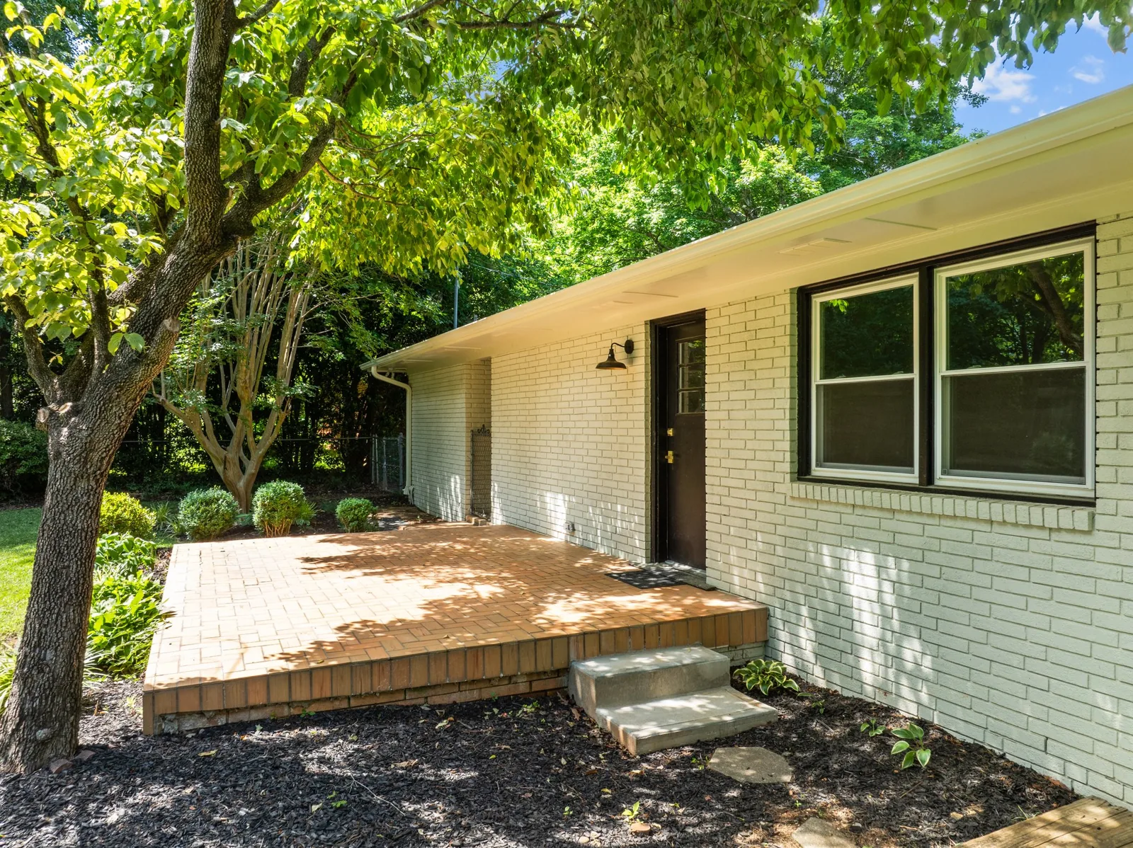 Roxanne: brick patio beside the garden